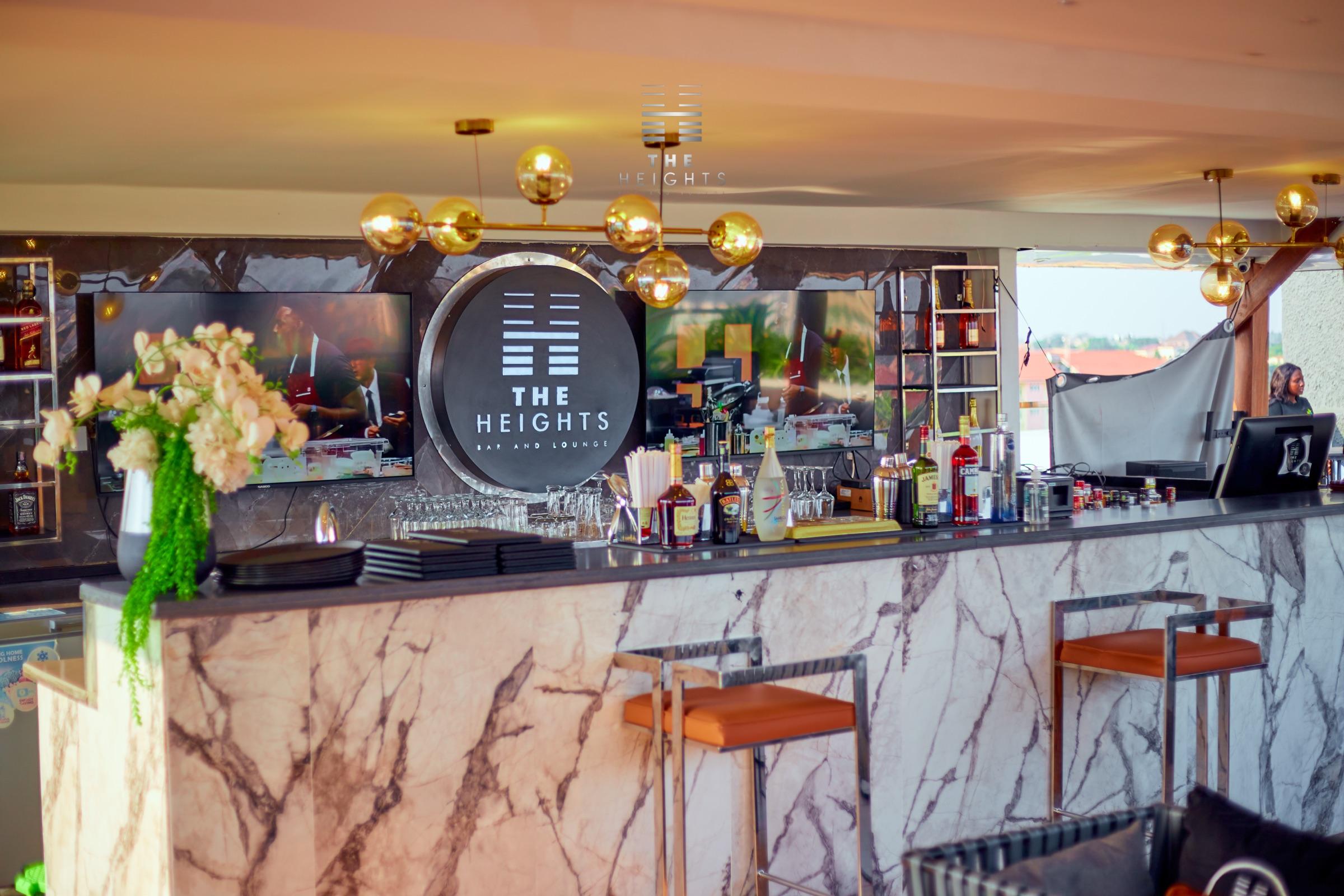 The marble bar and back bar at The Heights Bar & Lounge in Atasomanso, Kumasi
